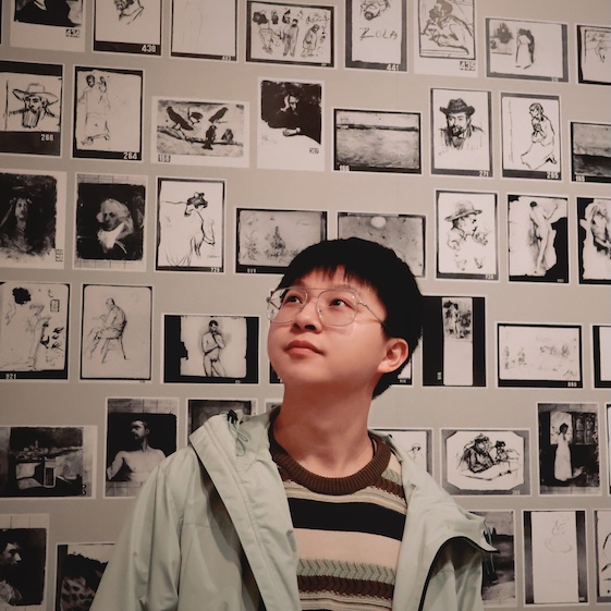 Profile Picture of Adrián Moreno (@zetxek), working side by side with a colleague: sitting on a desk, while looking at a screen